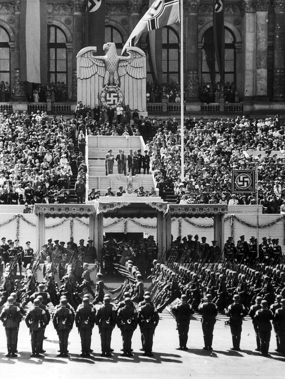 Parade of the Legion Condor in front of Berlin's Technische Hochschule in Charlottenburg, Adolf Hitler is in the tribune with officials and guests